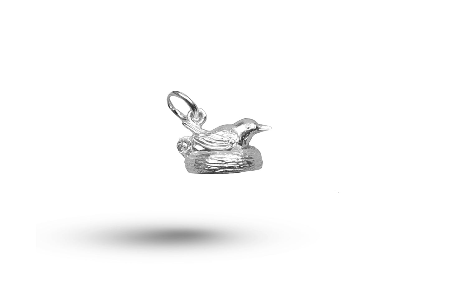 Luxury white gold bird on nest charm.