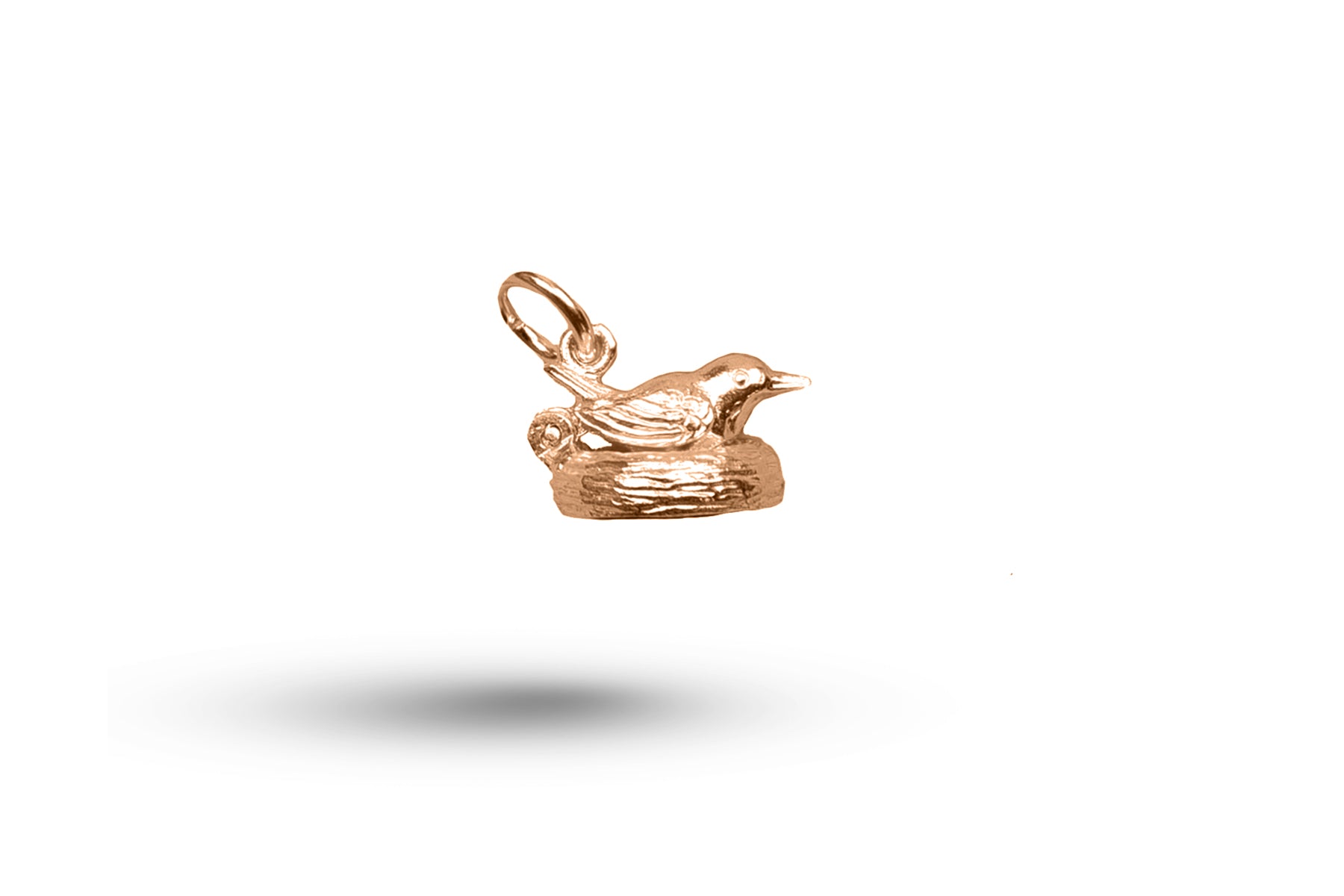 Luxury rose gold bird on nest charm.