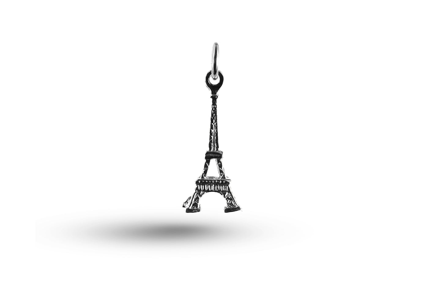 White gold Eiffel Tower charm.