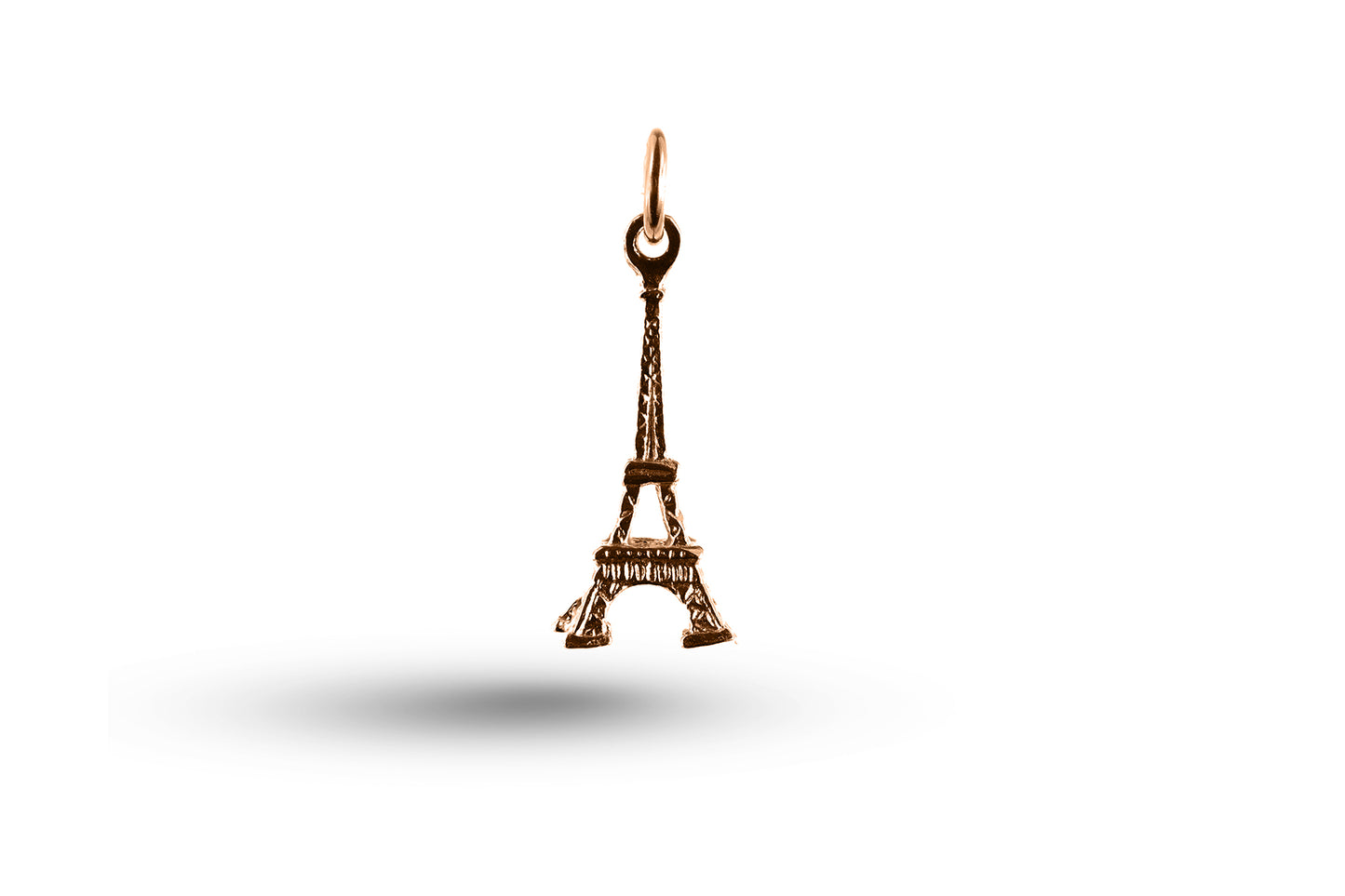 Rose gold Eiffel Tower charm.