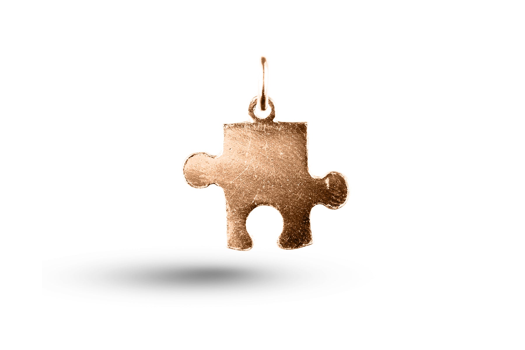 Rose gold Jigsaw Piece charm.