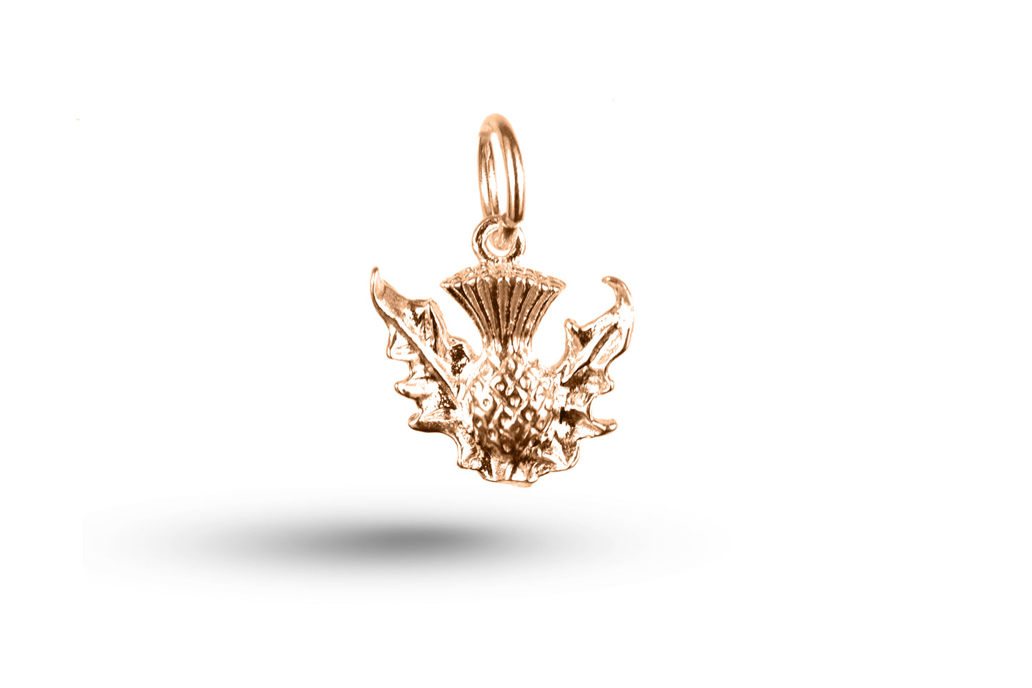 Rose gold Curled Thistle charm.