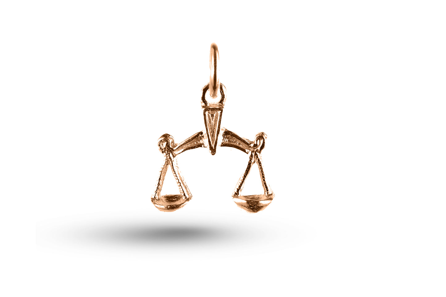 Rose gold Libra charm.