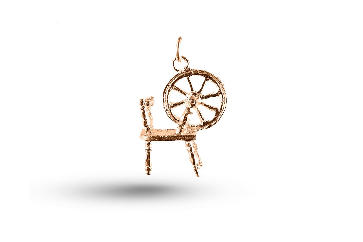 Rose gold Welsh Spinning Wheel charm.