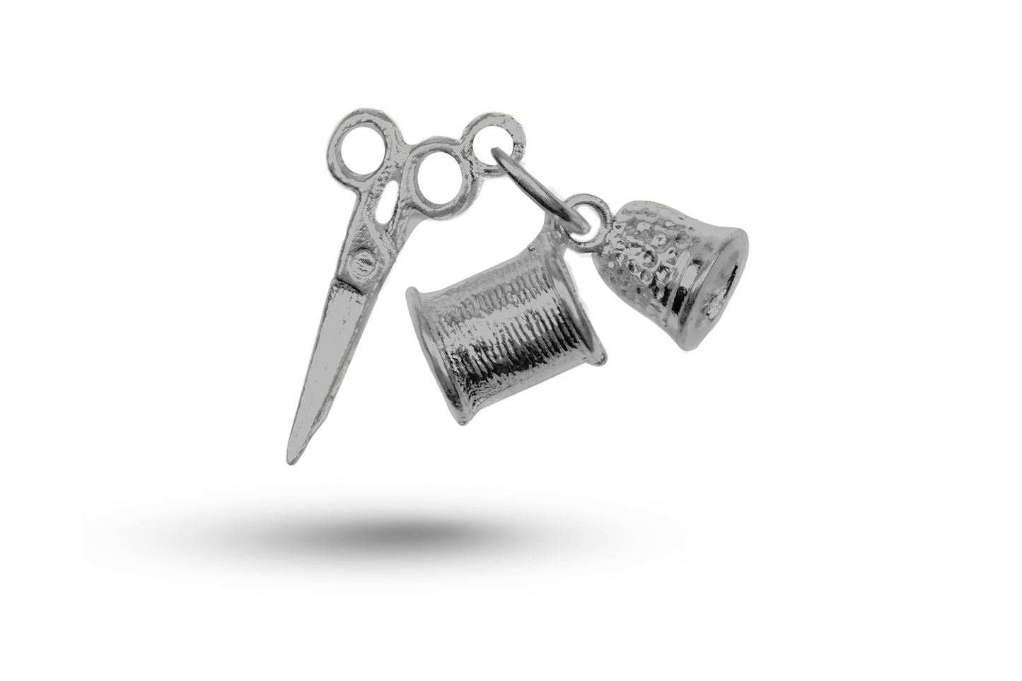 White gold Sewing Set charm.