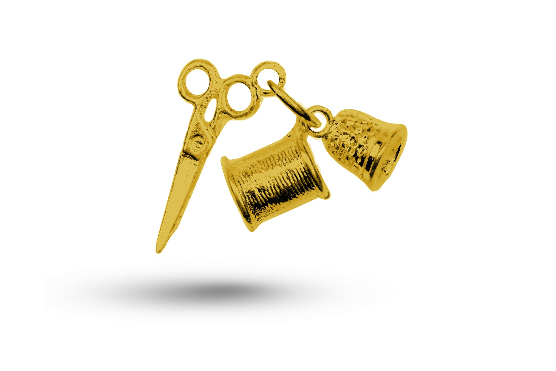 Yellow gold Sewing Set charm.