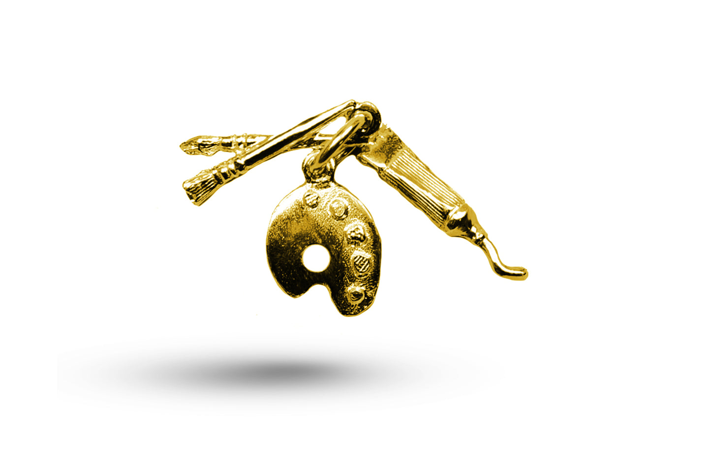 Luxury yellow gold artist set charm.