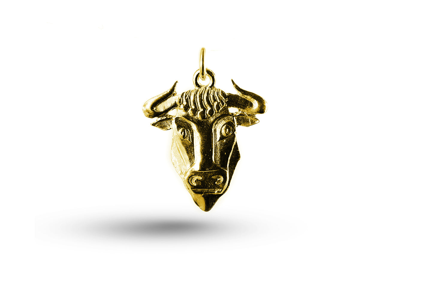 Yellow gold Taurus charm.