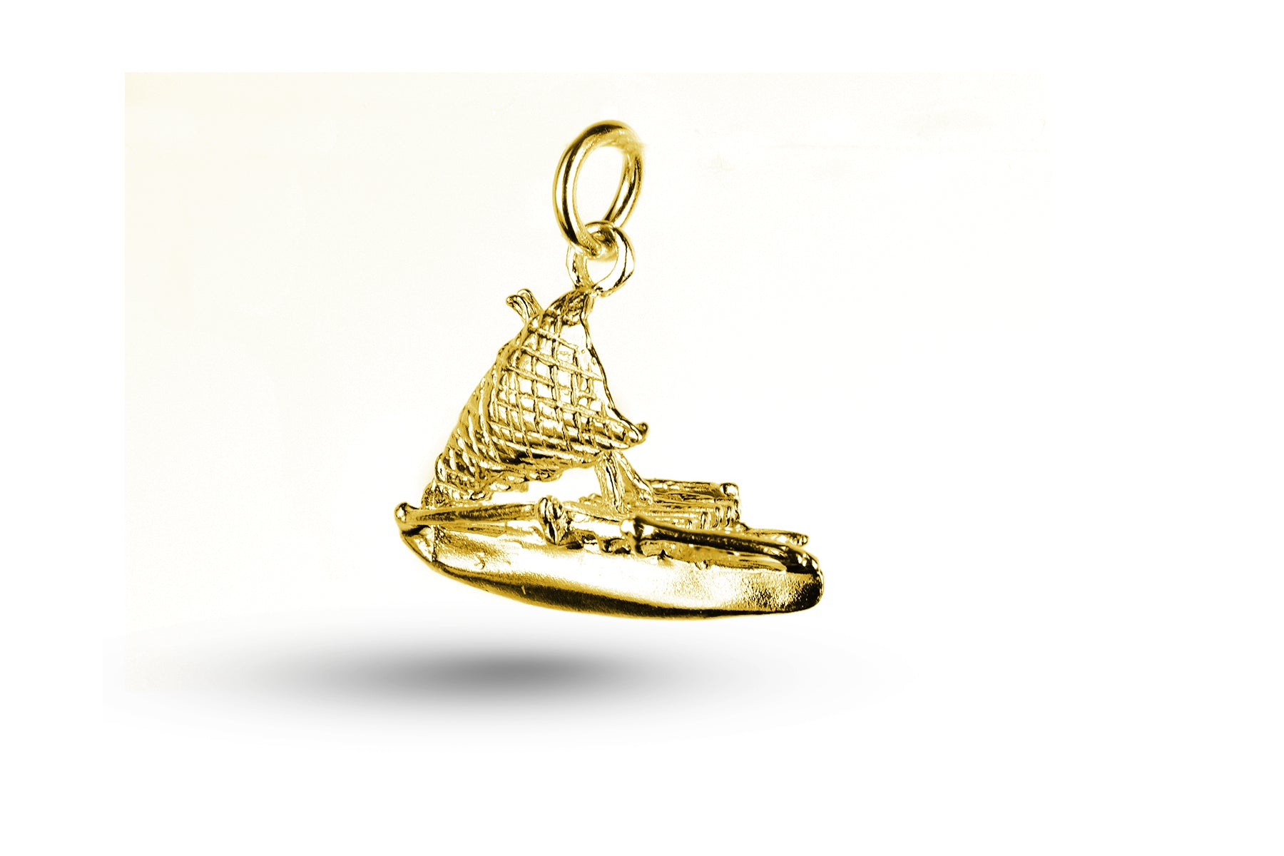 Yellow gold Outrigger charm.