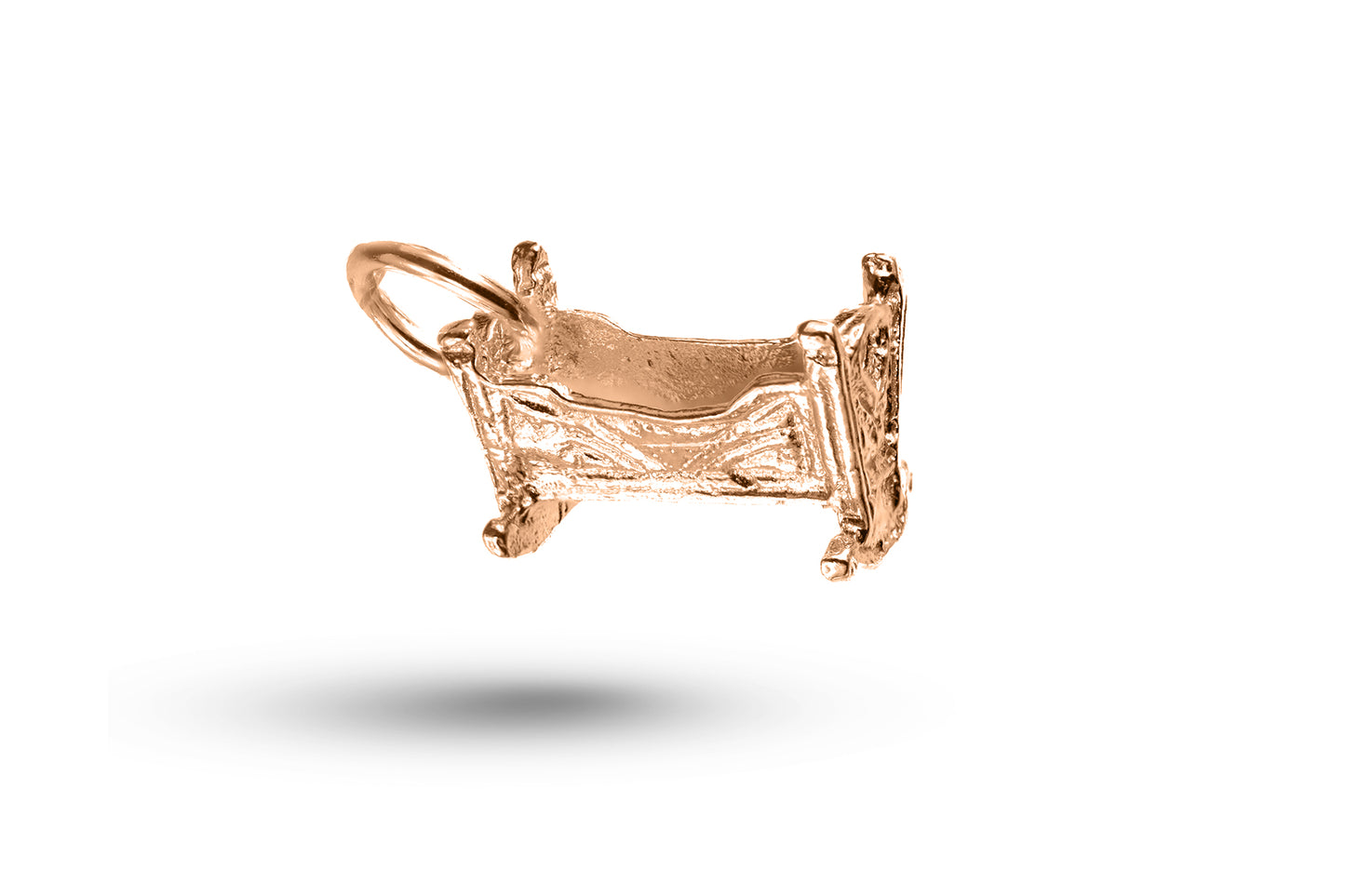 Luxury rose gold baby crib charm.