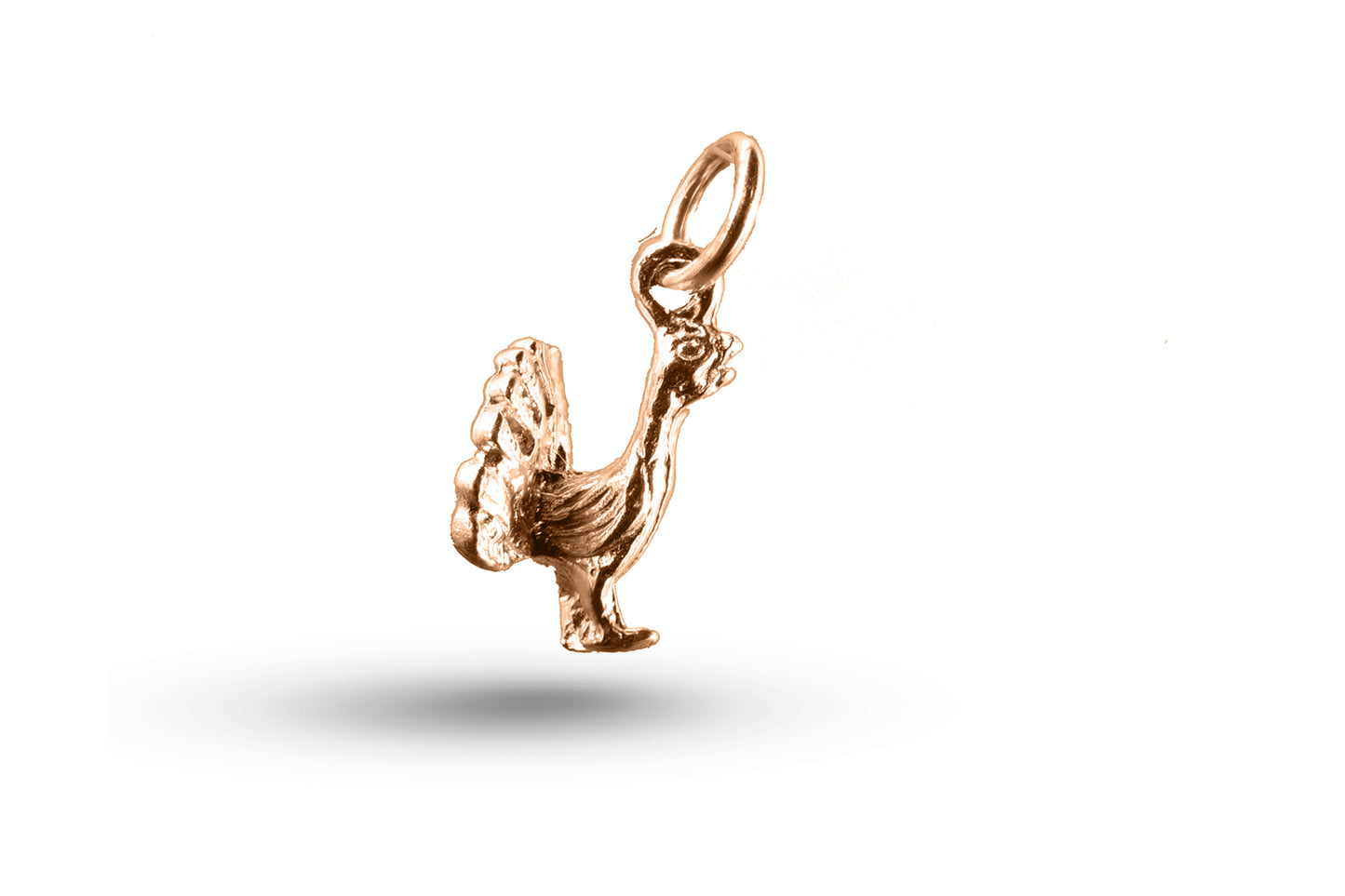 Rose gold Peacock charm.