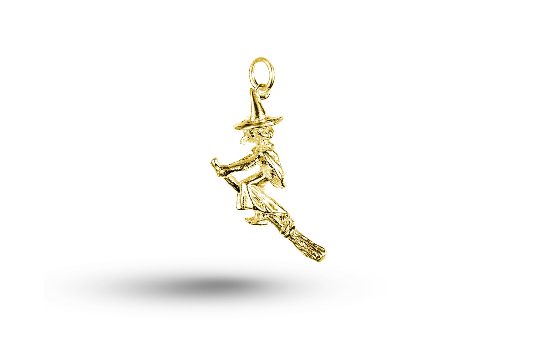 Yellow gold Witch on Broom charm.