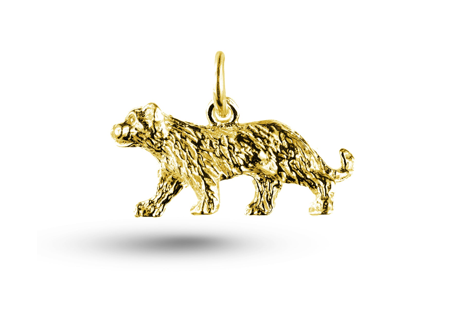 Yellow gold Puma charm.