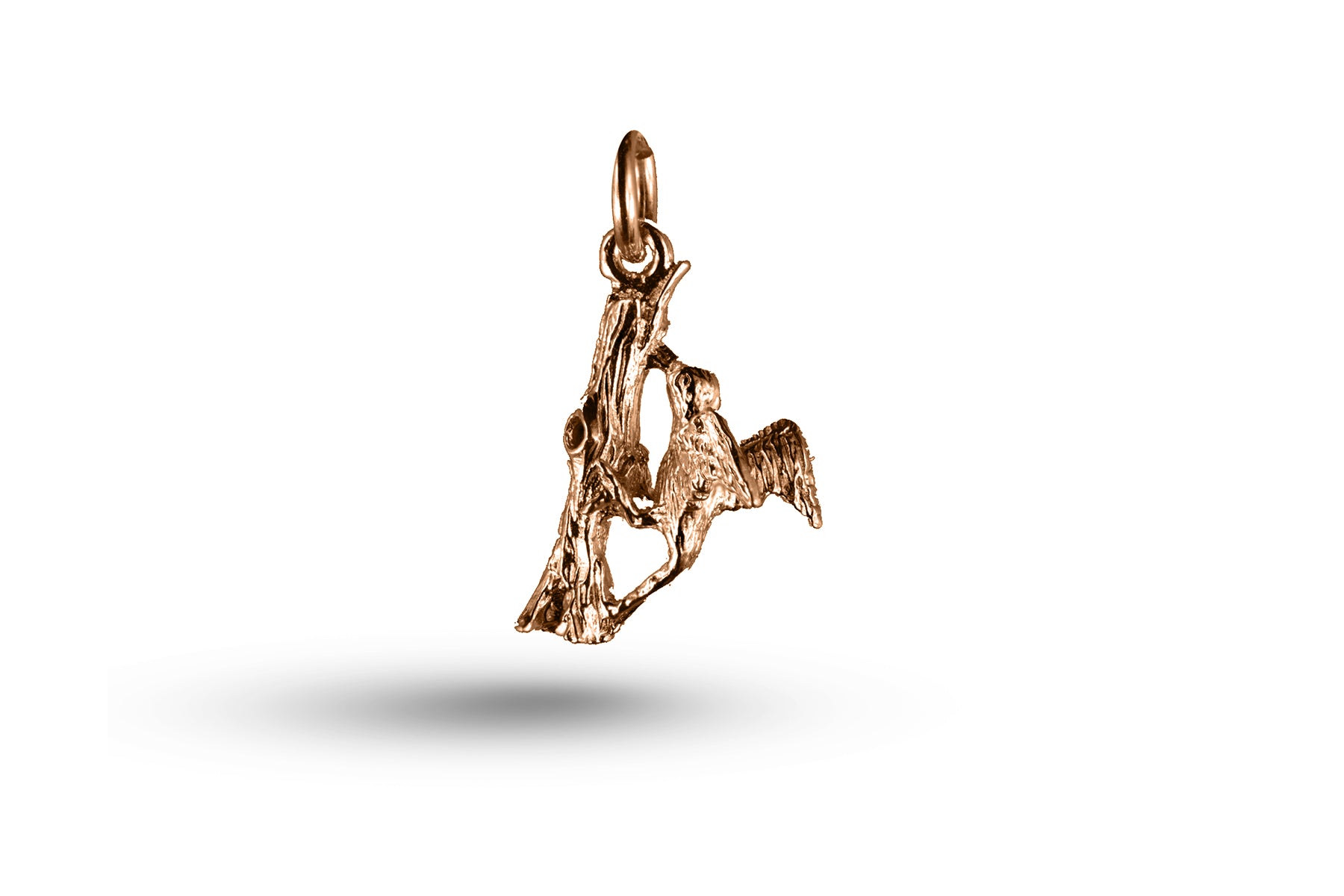 Rose gold Woodpecker charm.