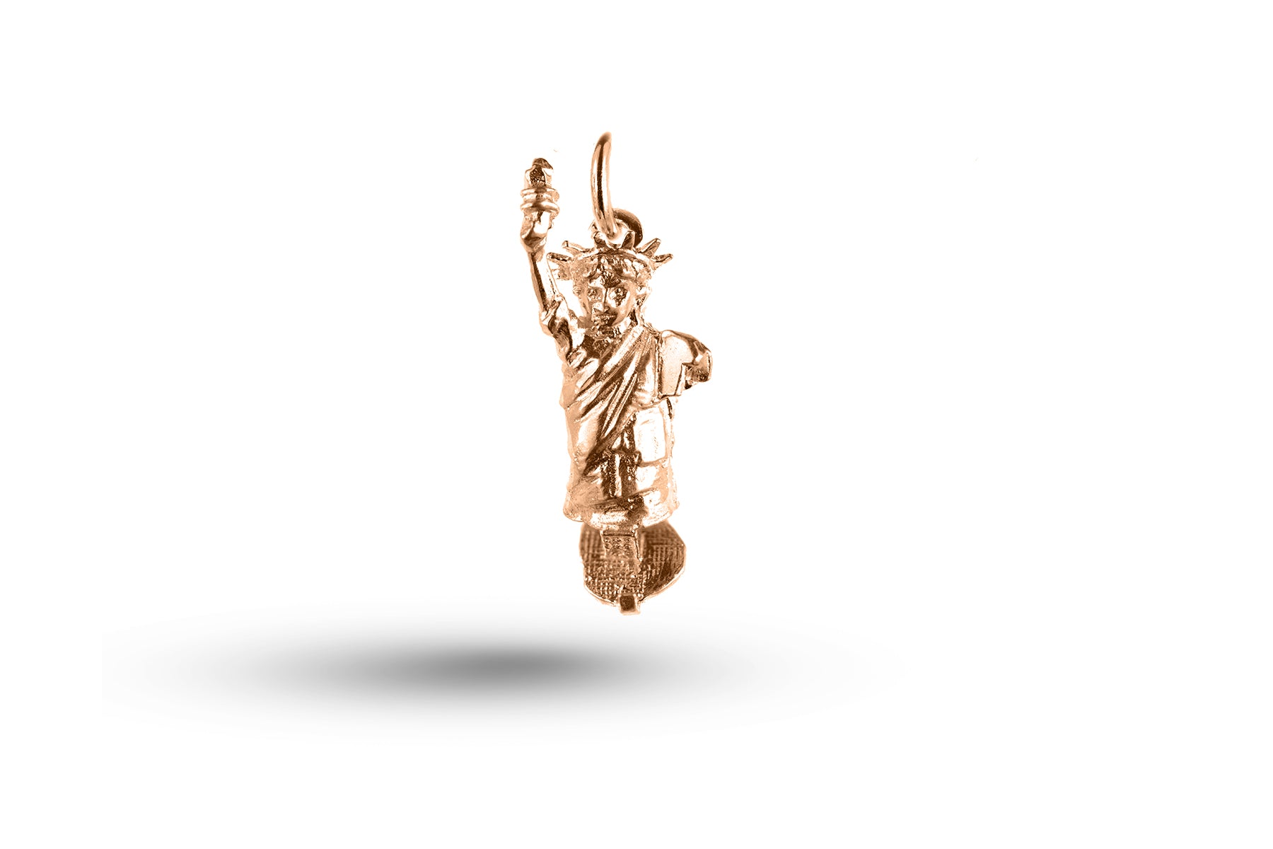 Rose gold Statue of Liberty charm.