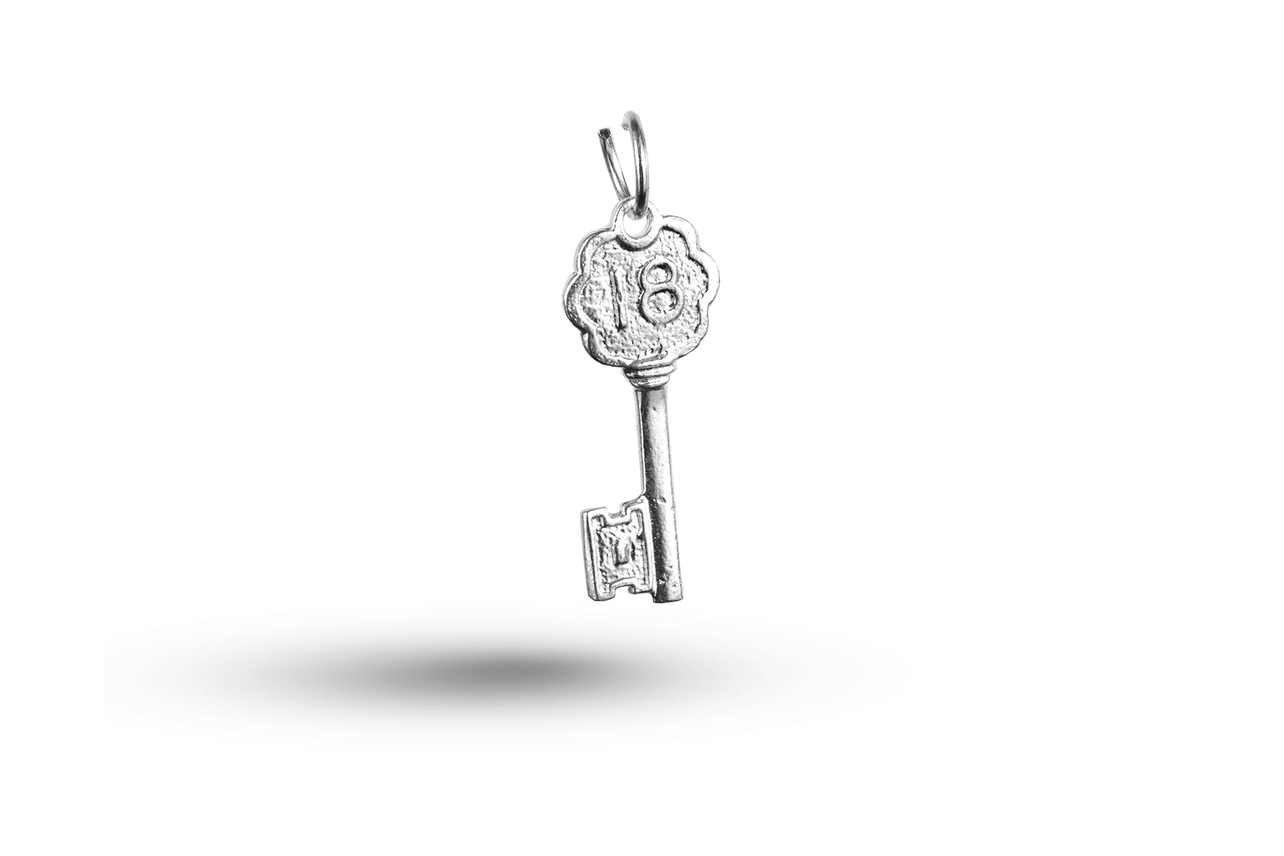 White gold Flower Birthday Eighteen Key charm.