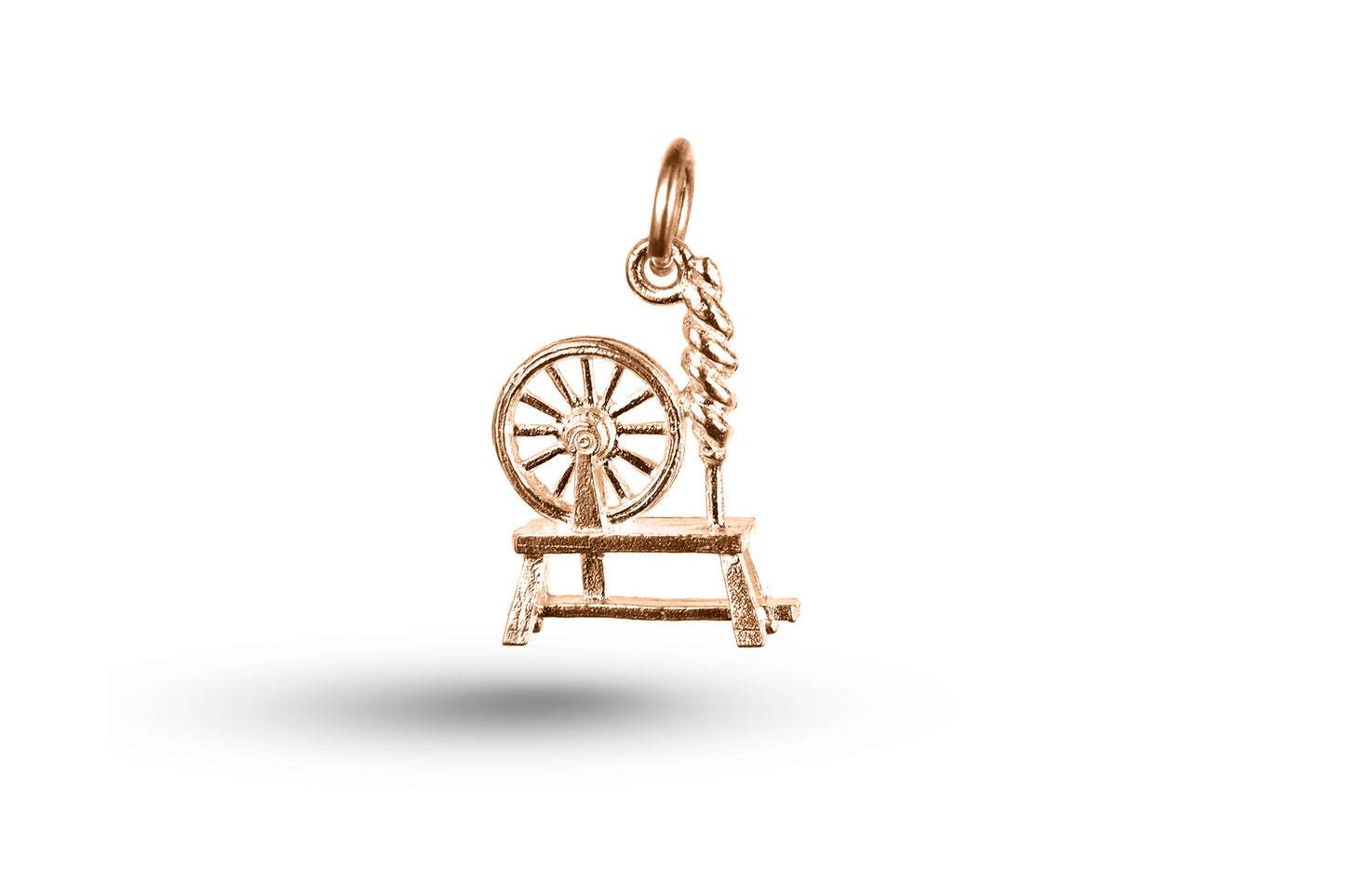 Rose gold Welsh Spinning Wheel charm.