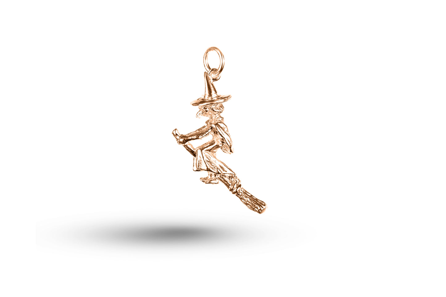 Rose gold Witch on Broom charm.