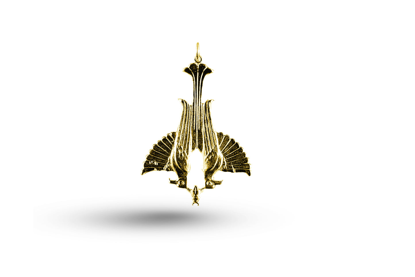 Yellow gold Winged Falcon charm.