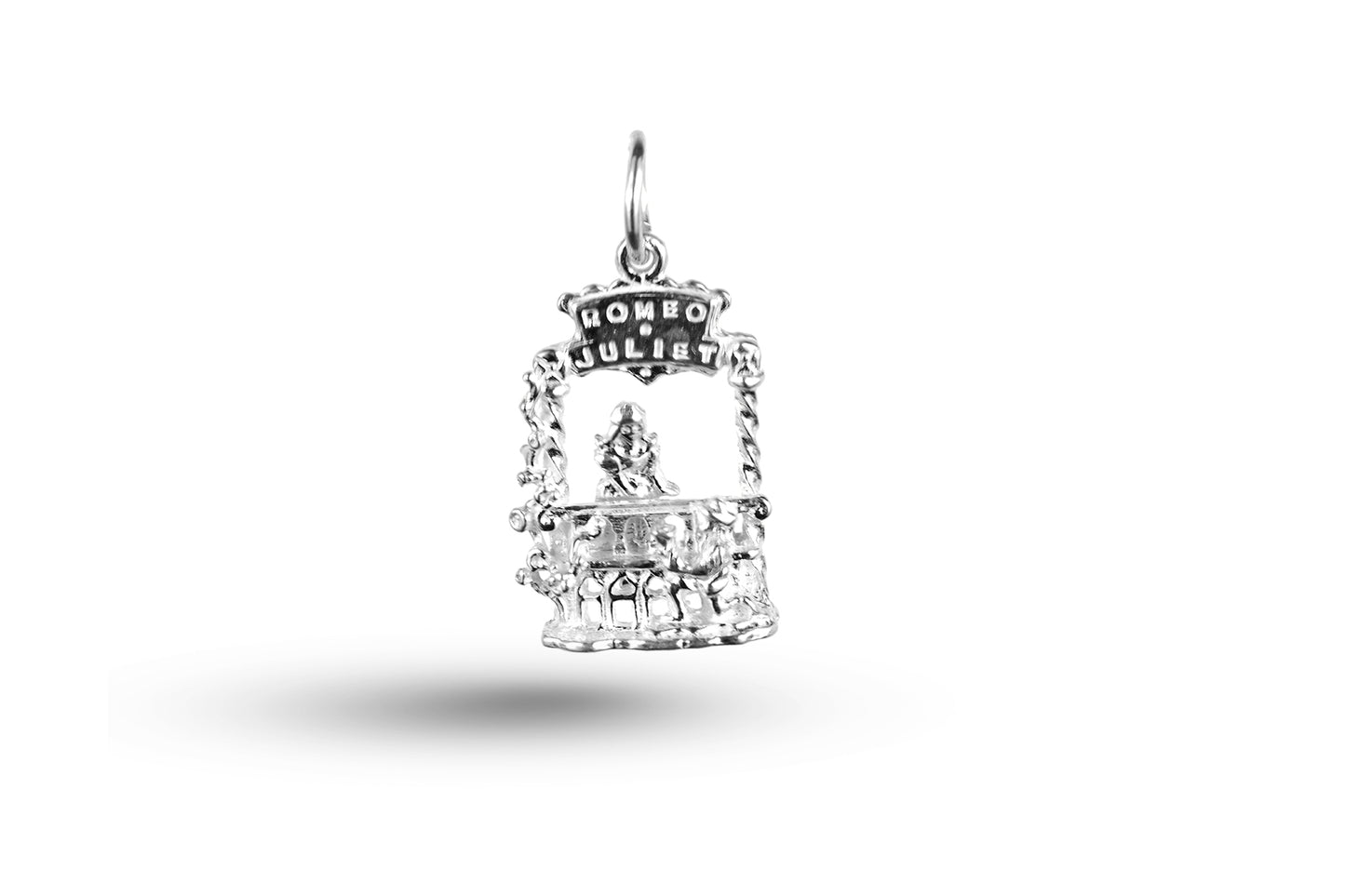 White gold Romeo and Juliet charm.