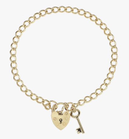 Luxury yellow gold curb charm bracelet with key and heart shaped padlock.